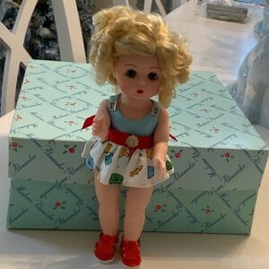Madame Alexander Blonde Doll in Blue and printed sundress with beach articles.